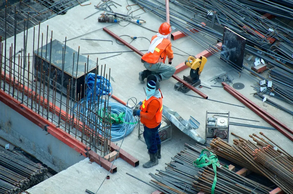 General contractor reviewing blueprints at a job site