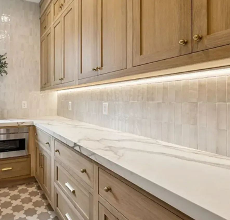 Glass sliding door, marble backsplash, patterned tile floor